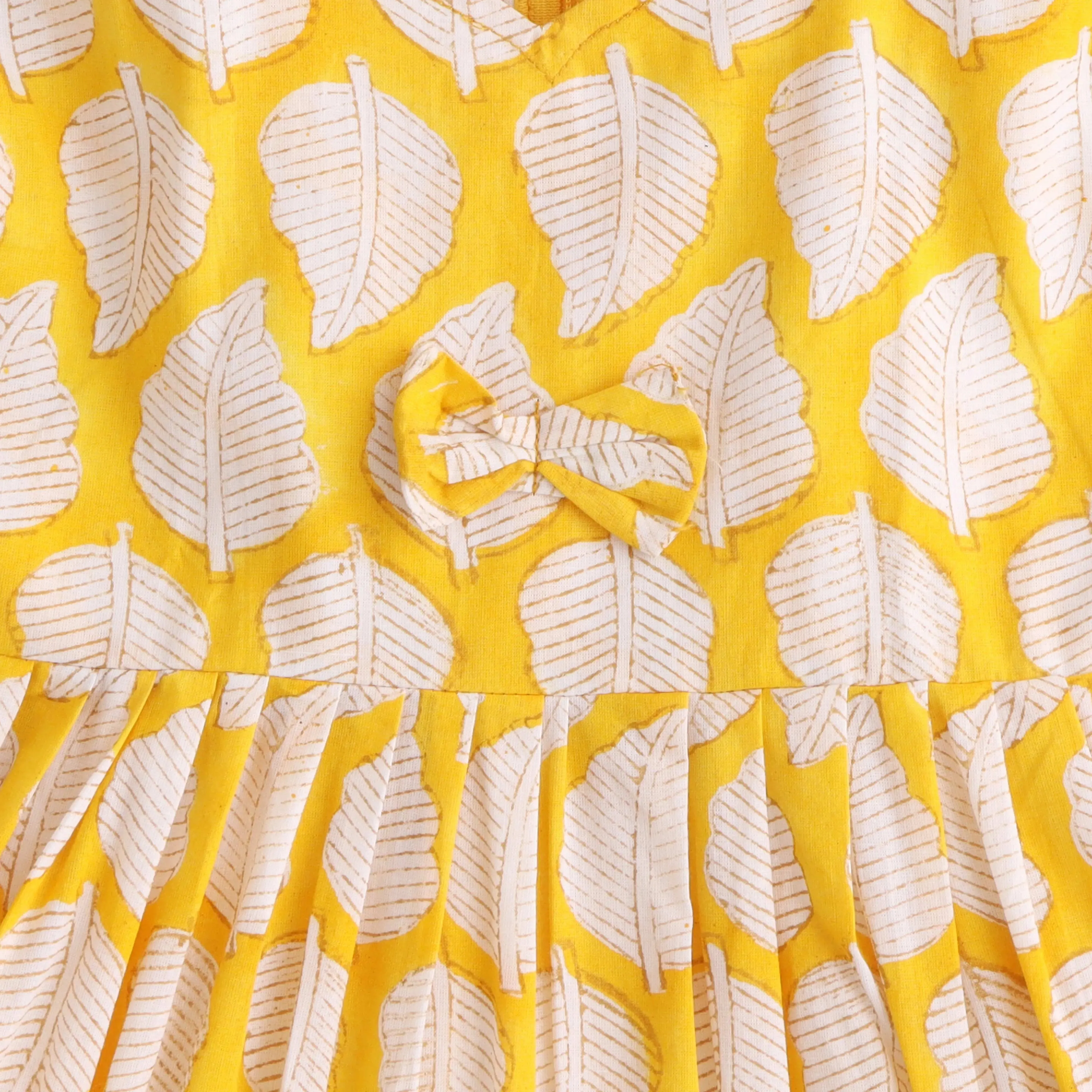 Golden Leaf Gala: Charming Yellow Cotton Frock with Nature-Inspired Prints
